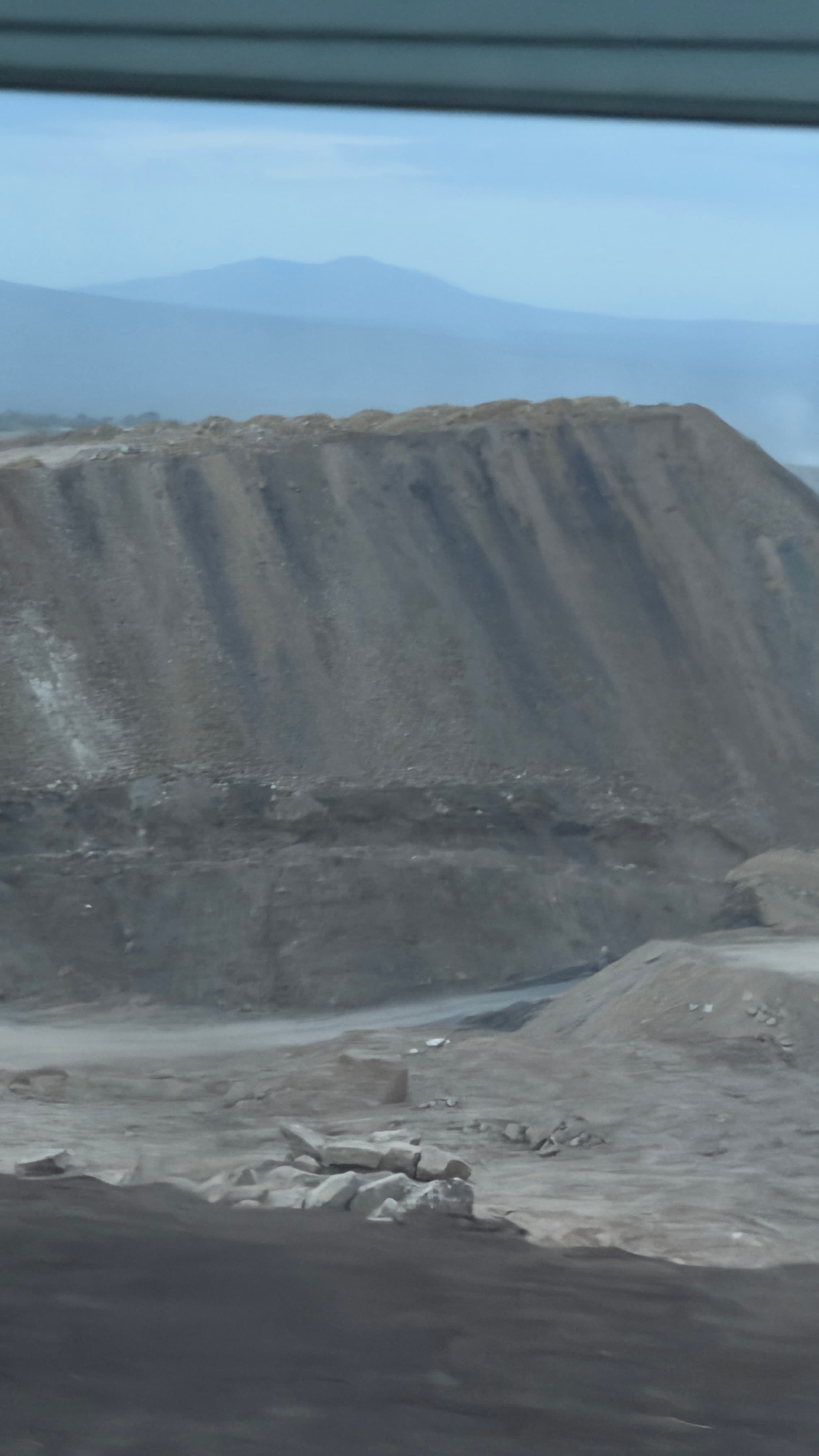 Open-pit basalt quarry and deep bench excavation operations for aggregate production in the Ethiopian highlands