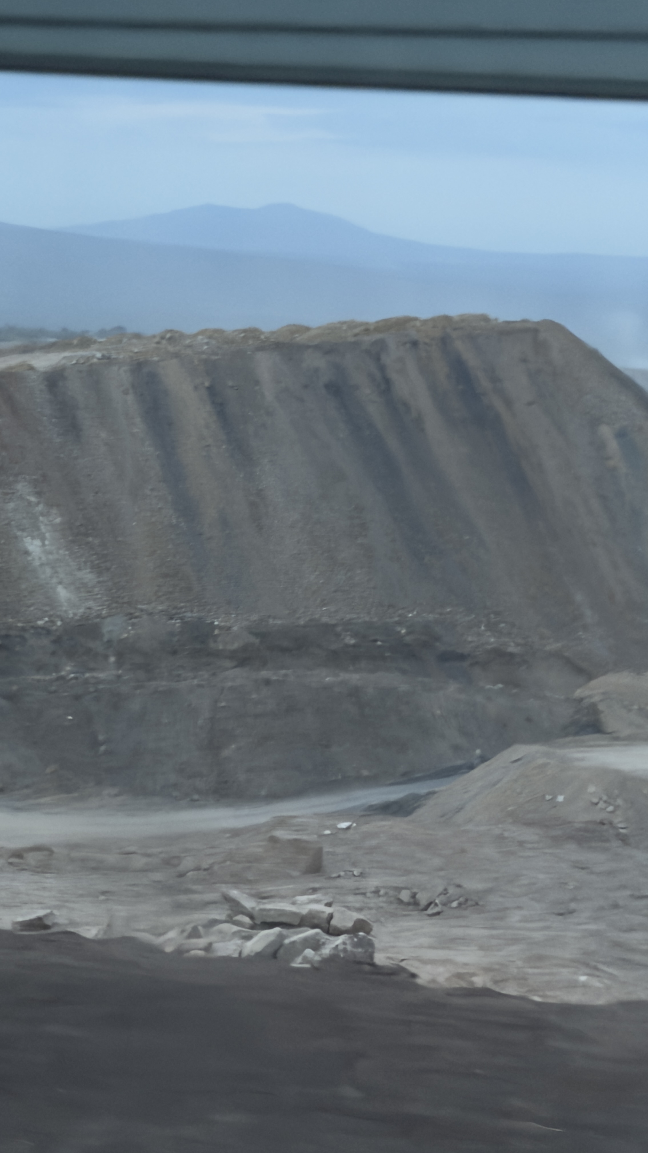 Open-pit basalt quarry and deep bench excavation operations for aggregate production in the Ethiopian highlands